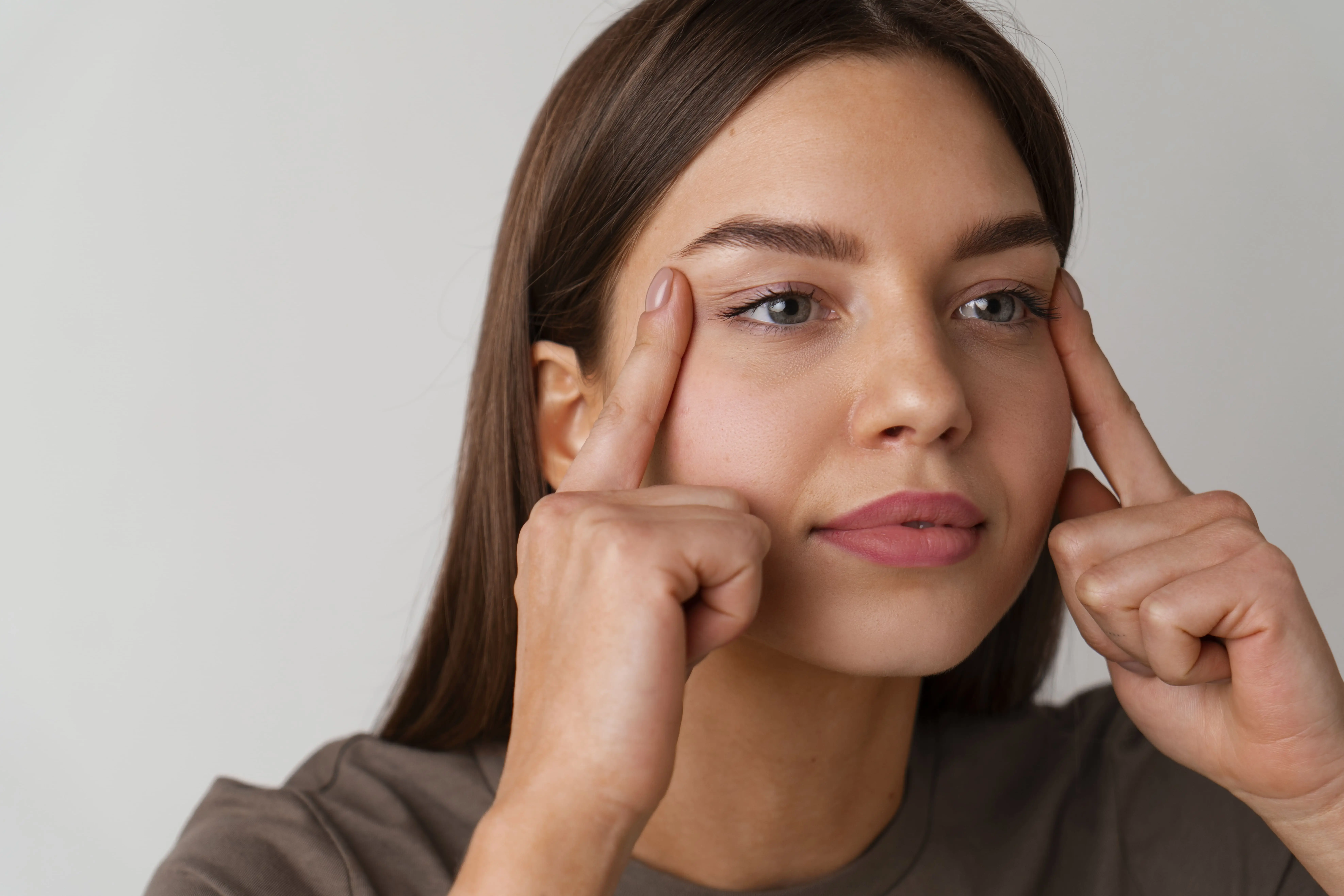 front-view-woman-practicing-facial-yoga-17-1