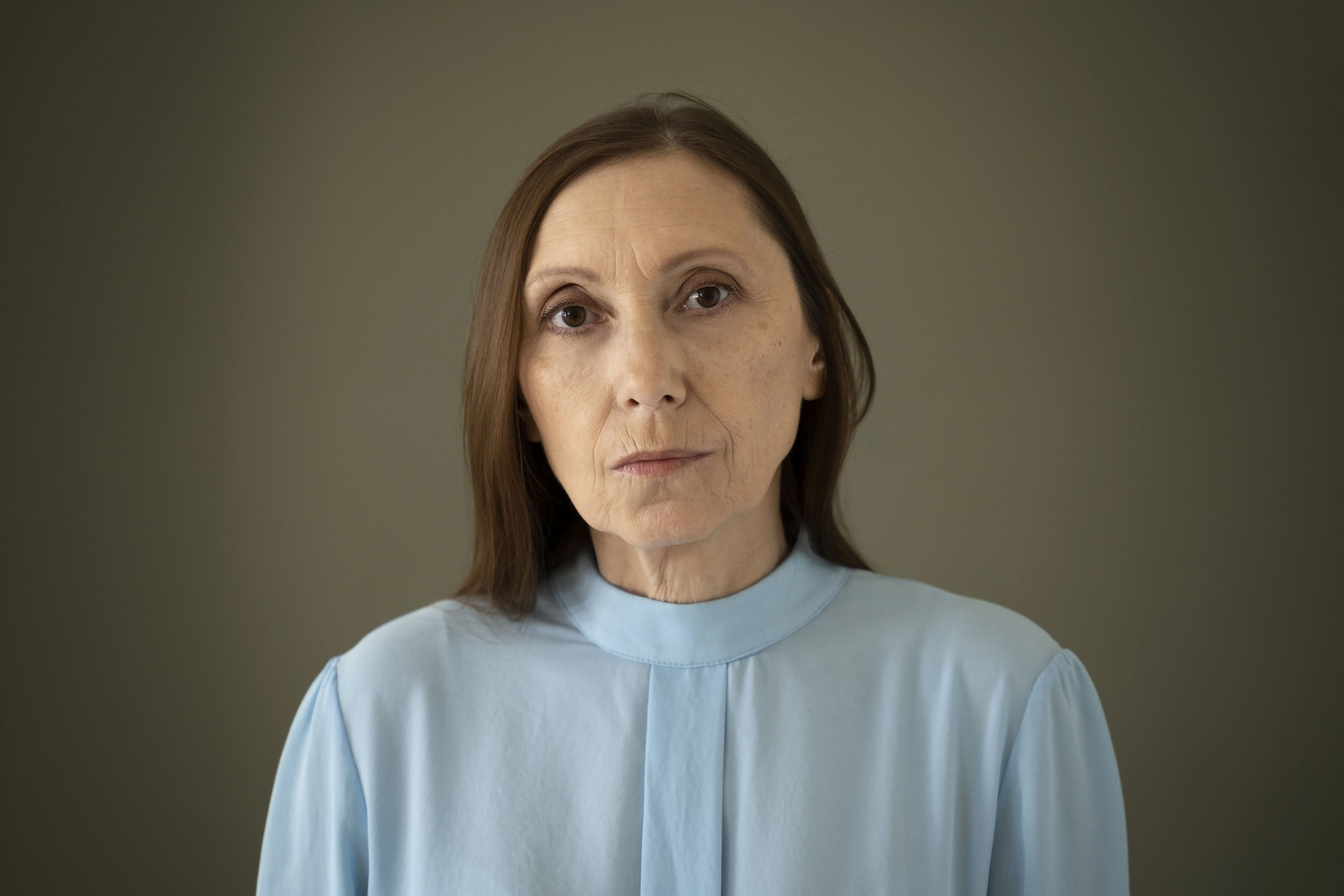 front-view-wise-woman-posing-studio-2