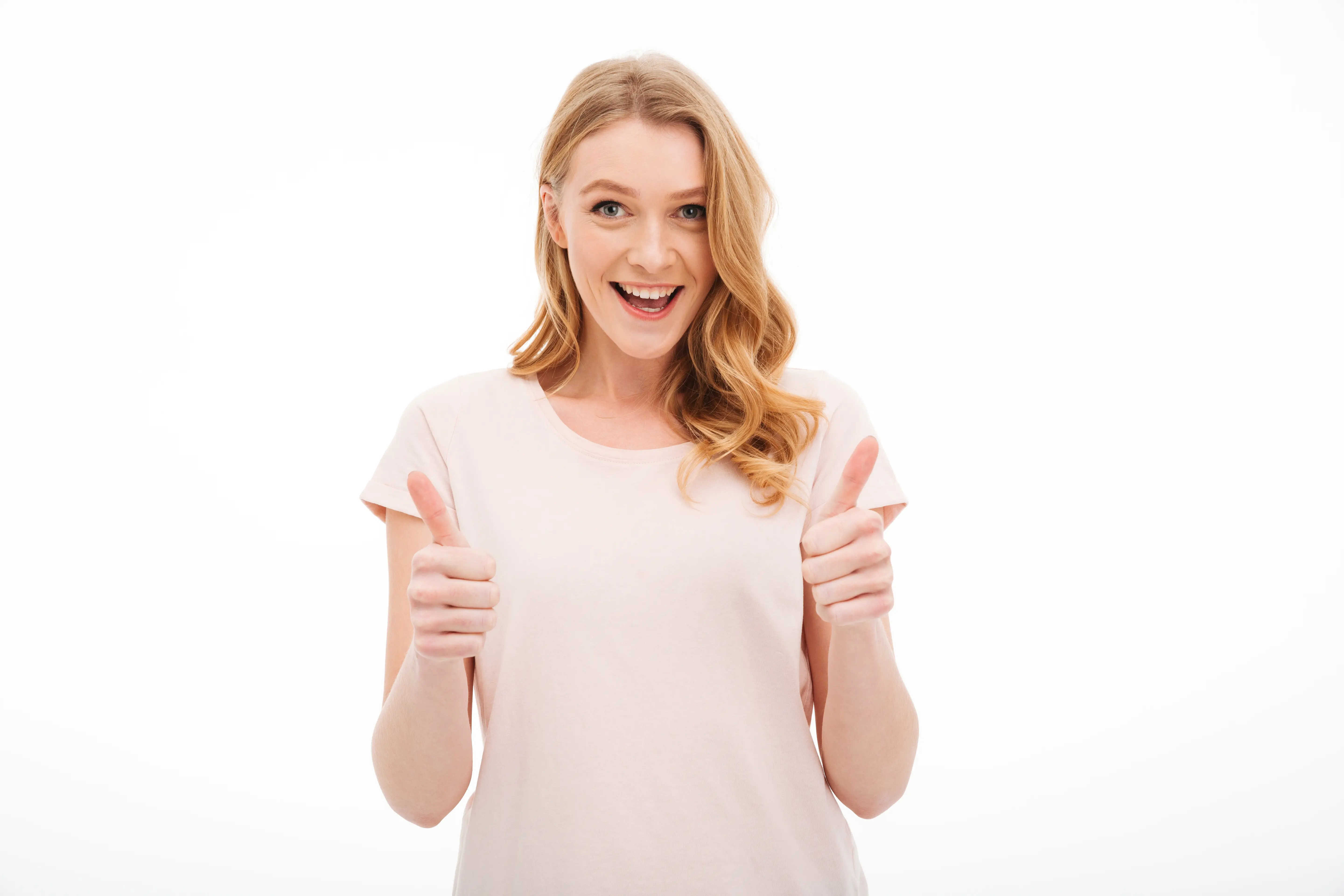 cute-young-smiling-woman-showing-thumbs-up